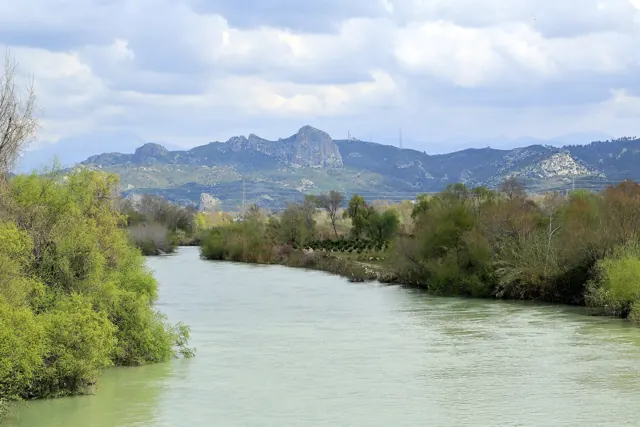 The wide, green river Eurymedon flowing between wooded banks in Pamphylia
